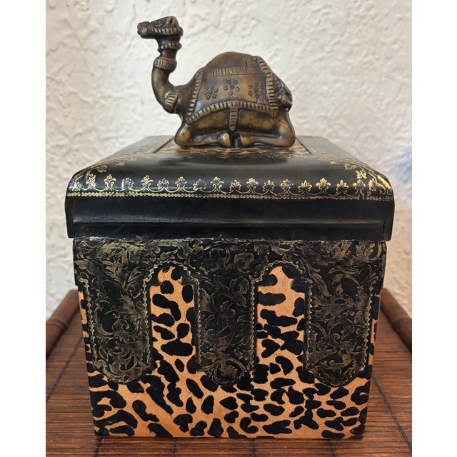 A rare decorative hinged storage box from the JOHN-RICHARD Collection. This magnificent box features gorgeous leopard...