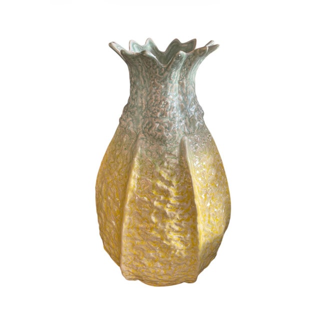 Standing at an impressive 20 inches tall, this substantial piece is sculpted with a heavy, dimpled relief that beautifully...