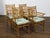 A set of four English Midcentury faux bamboo armchairs with thin cushions. This set of four English Midcentury armchairs,...
