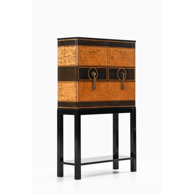 This rare and exceptional cabinet was designed by otto schulz and produced by boet in sweden during the 1930s. It stands...