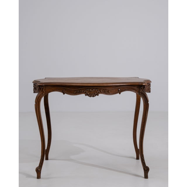 A charming Louis XV side table retaining its original patina, showcasing natural wear that enhances its authenticity. The...