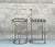 Design Institute of America bronze finished steel Memphis bar stools. No makers mark. Dimensions-Overall 40"H x 18.5"D x...