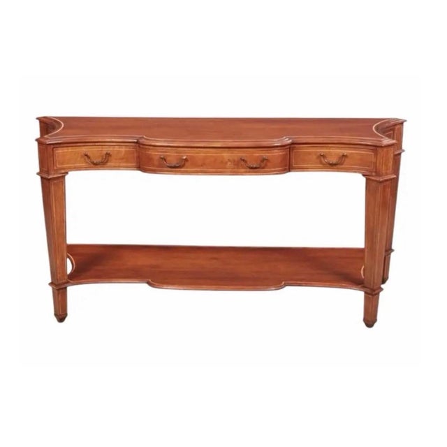 Dessin Fournir Neoclassical Style Mahogany Serpentine Console Table. Unsigned. An elegant serpentine console table...