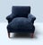 A vintage accent chair featuring deep blue velvet upholstery, a pleated sock arm design, and tapered wooden legs. A Very...