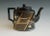 Aesthetic Movement Black-Glazed Pottery Teapot and Cover, Attributed to Dudson, Staffordshire Circa 1885 An English black-...