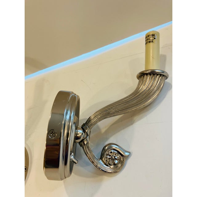 This pair of sconces of high quality nickle silver Are signed Chapman The attached switches give you the option of hand...