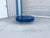 Mid-century blue painted round coffee table styled after Willy Rizzo, designed and manufactured in the United States,...