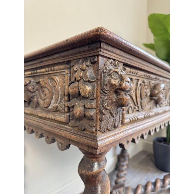 Bring timeless character and old-world charm to your home with this antique carved wood console table, featuring stunning...