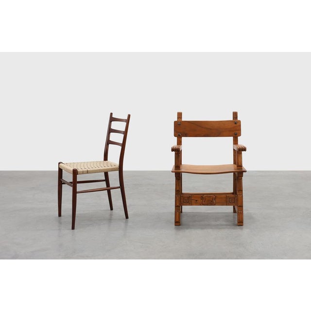 Dating back to circa 1900, this Spanish armchair tells a story of enduring Iberian craftsmanship and honest, timeless...