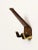 This ebonized brass coat or hat hook is partially covered with brown leather. It has an elegant shape and is of perfect...