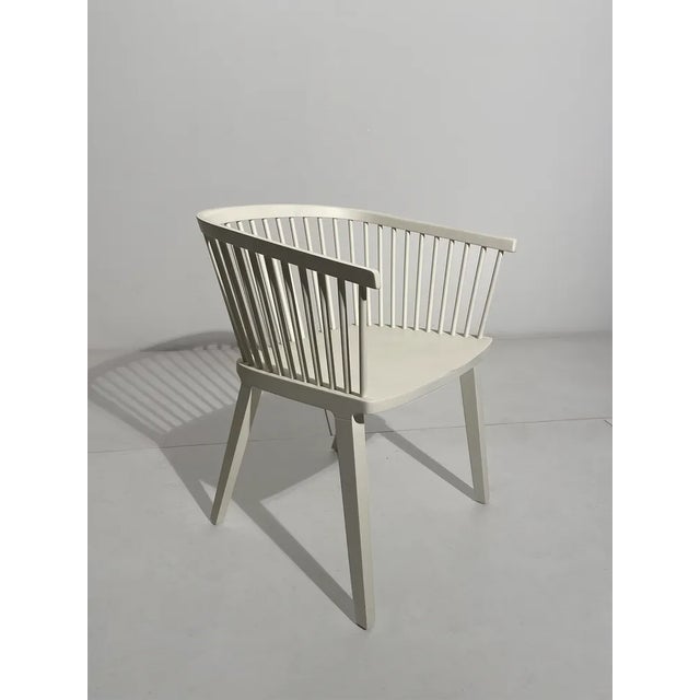 Solid beech wood armchair. Back composed of feattes inserted by interlocking in the base. This piece is attributed to the...