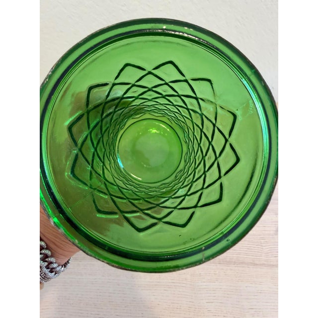 This beautiful emerald green glass vase caught my eye with its rich color, elegant silhouette and distinctive raised...