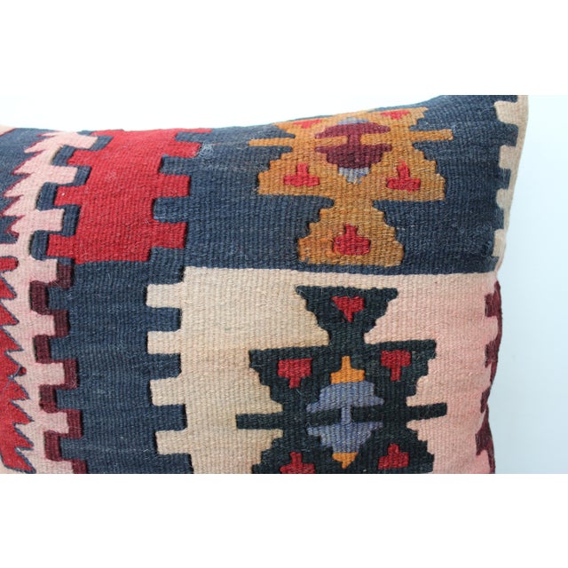 This Turkish pillow cover is made from the highest quality vintage Kilim in 100% wool on the front. The back is covered in...