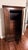 This is an Antique Art Nouveau oak wardrobe featuring a single mirrored door and a drawer. The design embodies the...
