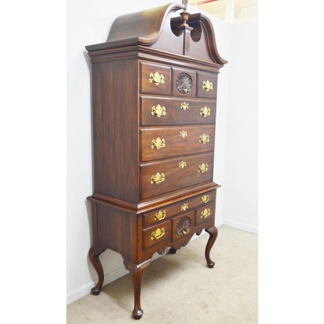 Mahogany Highboy by Henkel. Harris. Store item #535. It features ten dovetailed drawers and brass hardware.
