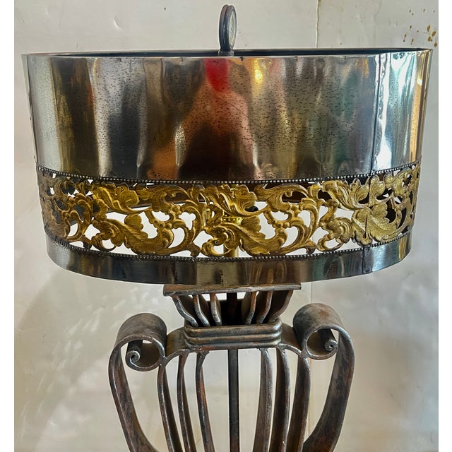 Very pleased to present you with very unusual and very heavy Neoclassical French Wrought Iron table lamp, 1940s This urn...