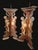 Pair of large palace candle holders in painted wood, featuring shaped representations of triumphant putti holding a...