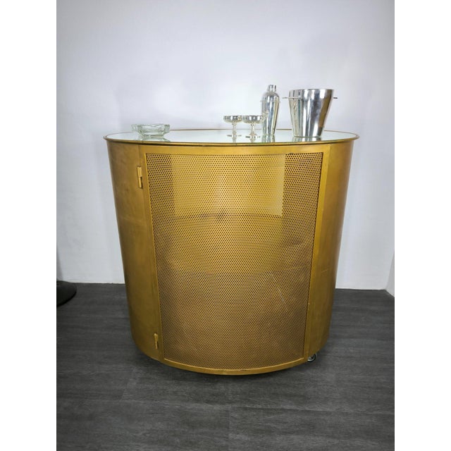Bar counter/cabinet on wheels In the style of Eugenio Gerli Italian manufacturing Painted iron Mirrored glass top Grid...