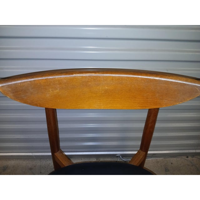 Harry Ostergaard for Moreddi Mid Century Teak Dining Chair. Hardwood frame with leather upholstered seat. Designed by...