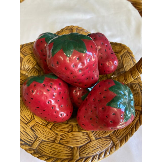 This charming mid-20th century ceramic basket features ripe red strawberries nestled inside a woven-look ceramic basket....
