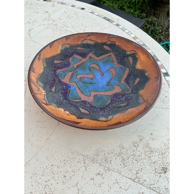 A substantial signed studio pottery centerpiece bowl by Potters Brown, featuring a dramatic hand-glazed surface in layered...