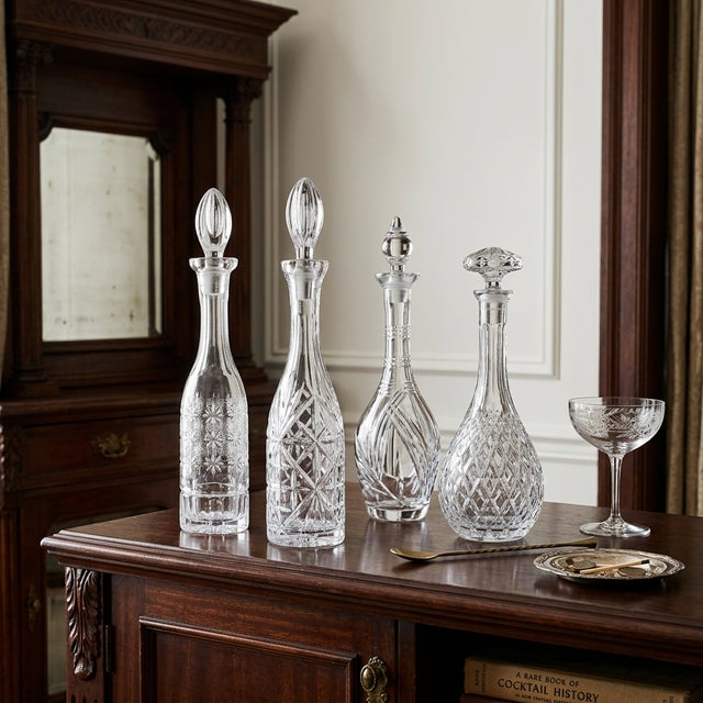 Antique cut glass decanter dating to the American Brilliant Period, circa 1876 to 1917. Clear lead crystal with an...