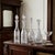 Antique cut glass decanter dating to the American Brilliant Period, circa 1876 to 1917. Clear lead crystal with an...