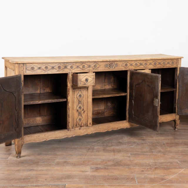 This French sideboard is crafted in oak and offers a traditional French country look in an impressive scale measuring over...