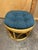 Cute little vintage rattan ottoman footstool with peacock blue cushion. Great vintage condition.