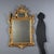 Carved and gilded wood mirror, Italy, late 19th century, featuring a molded frame with a cord carving enclosing a mercury...