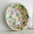 A vintage enamelware bowl customized with bright floral decoupage inside and out. The original 1940s bowl is a soft...