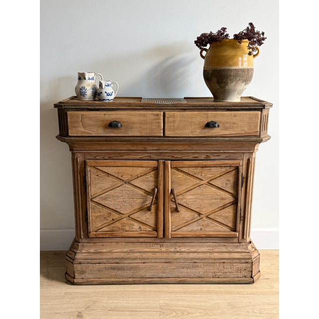 An exceptional 19th-century French pine shop counter with beautiful paneled detailing and remarkable patina throughout....