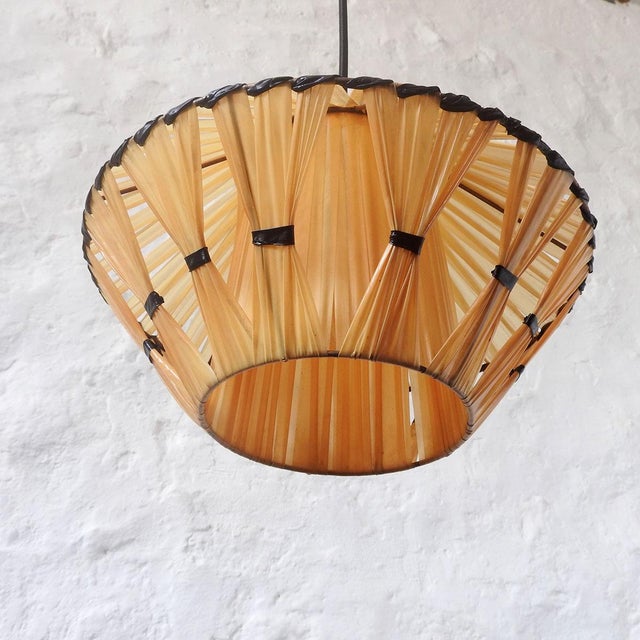 Shade covered in soft yellow synthetic raffia with black details. Textile cord. France, 1950s Height: 16 cm Height with...