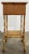 Antique sewing table featuring a rich scorched bamboo finish with woven top and lower shelf surface. Top opens by hinge to...