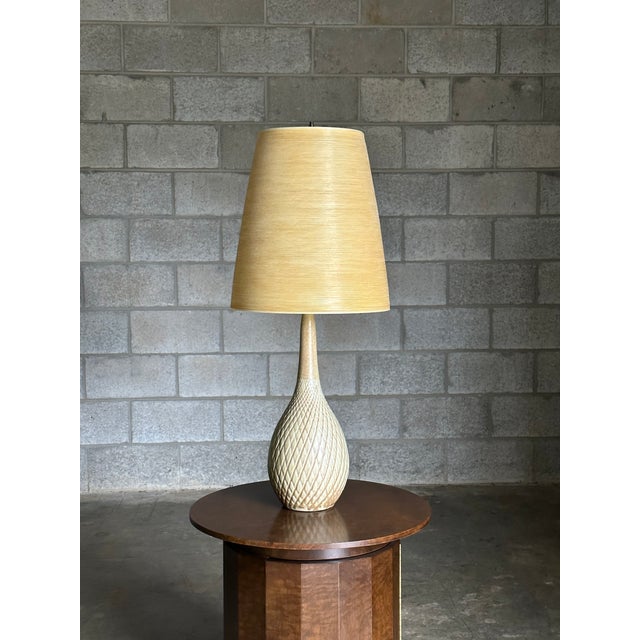 A wonderful ceramic table lamp by Lotte and Gunnar Bostlund table lamp. What sets this lamp apart from the rest is the...