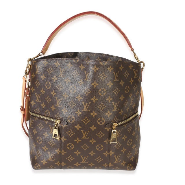 Item #: 153874 Interior Material: Microfiber Dimensions: 16 x 12 x 5 in Features Interior: Three slip pockets. Handle...