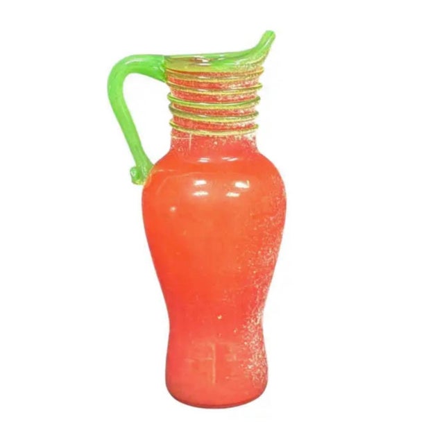 Vintage Murano Art Glass Scavo- Style Pitcher. Pitcher features a rich coral-red, textured and frosted glass body...