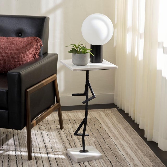 Introducing the Warso Marble Side Table in stunning white and black. This table is designed to bring elegance and modern...