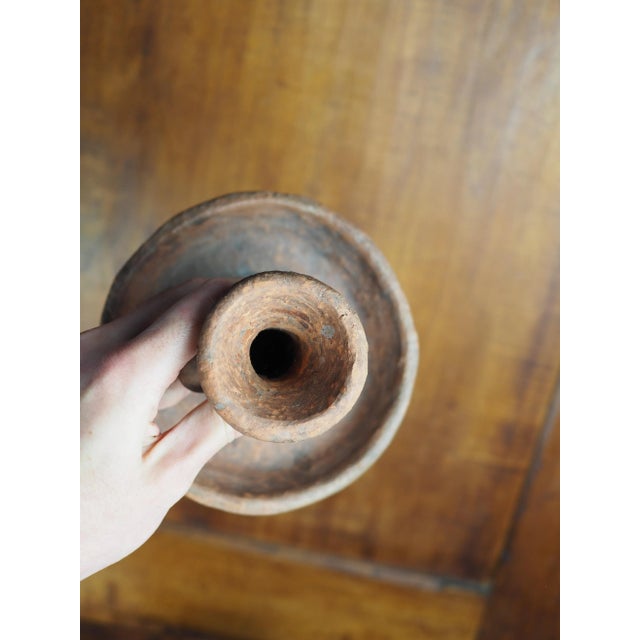 Raw terracotta candlestick with rounded and rough shapes. Piece close to raw art with a very earthy character. Can fit...