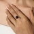 A vintage-inspired 925 sterling silver cocktail ring featuring a striking 10 mm round black star gemstone as its bold...