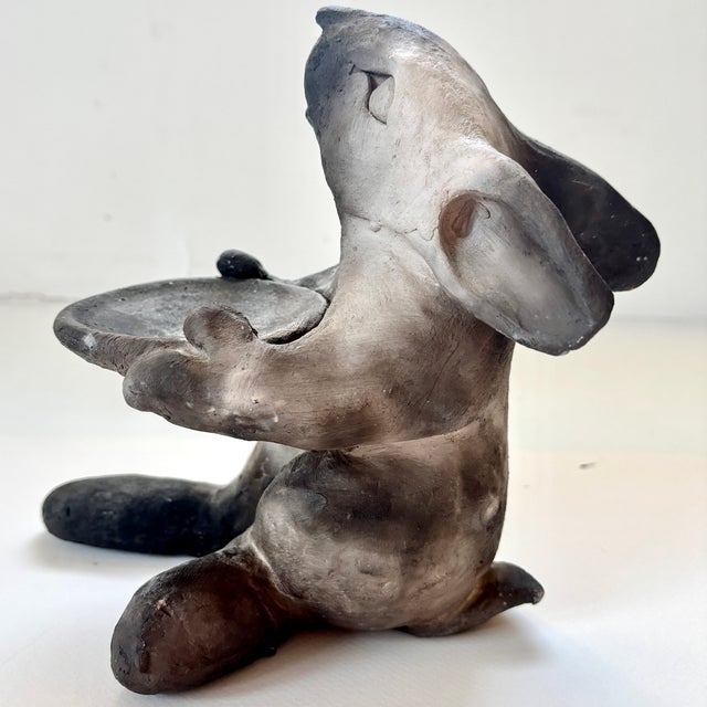 Charming handmade rabbit sculpture is signed, with a natural clay finish, no glaze. The rabbit is turning white as the...