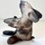 Charming handmade rabbit sculpture is signed, with a natural clay finish, no glaze. The rabbit is turning white as the...