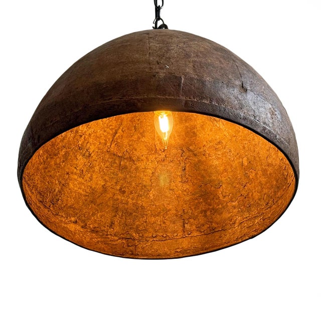 Vintage iron pendant light crafted from a hand-forged bowl from early–mid 20th century India. Such vessels were...