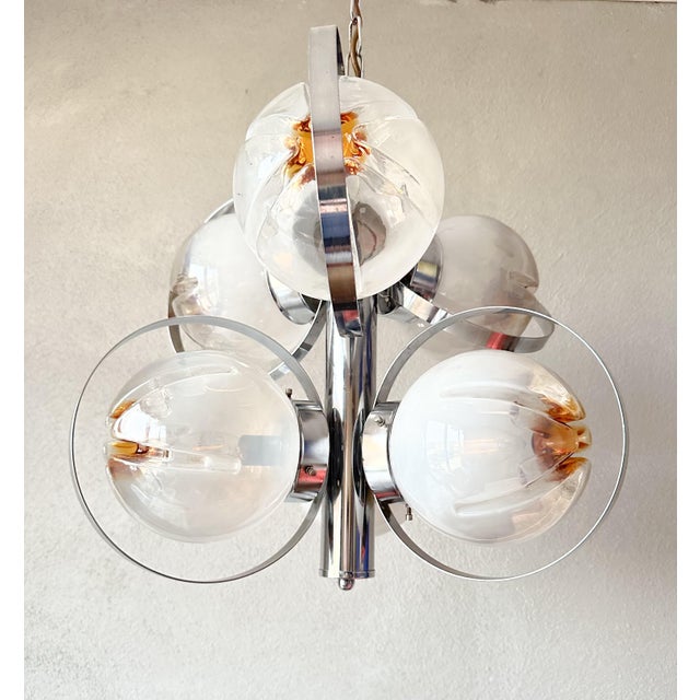 Bring a touch of retro flair into your home with this beautiful vintage Italian Mazegga Sputnik lamp. This unique...