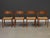 A set of four mid century modern teak frame dining chairs with paper cord seats by Poul Volther for Frem Røjle. Seat...
