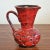 A wonderful bright red pitcher style vase with a dramatically flared lip in the 'Como' decor from an unknown Italian...