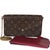 Item #: 154835 Features Interior: Two slip pockets. One zip pocket. Eight card slots Dimensions: 8.5 x 4.5 x 1 in Handbag...
