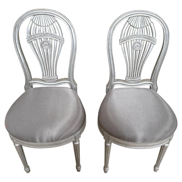 Pair of Maison Jansen-Style Silver Leaf Montgolfier Side Chairs, France A refined pair of Maison Jansen-style silver-leaf...