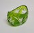 A sculptural mid-20th century cut-to-clear crystal bowl in a vivid apple green overlay, cut through to clear with deep...