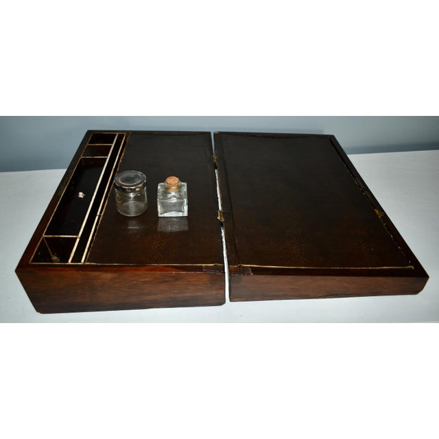 Antique (1880's) Lap Desk has a Regency Style. Made of Wood. Rosewood with Mother of Pearl Inlay. The Measurements: 15"L x...